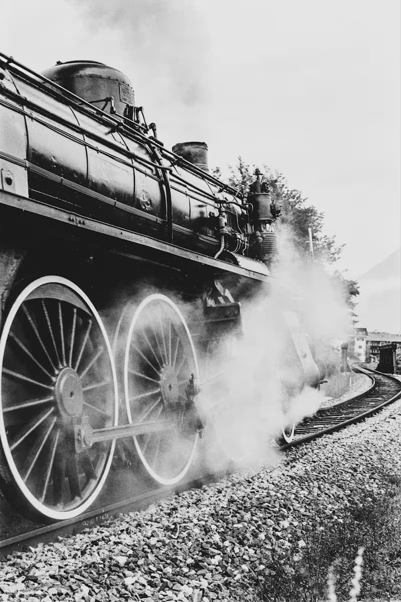 A black and white photograph of a historic steam locomotive